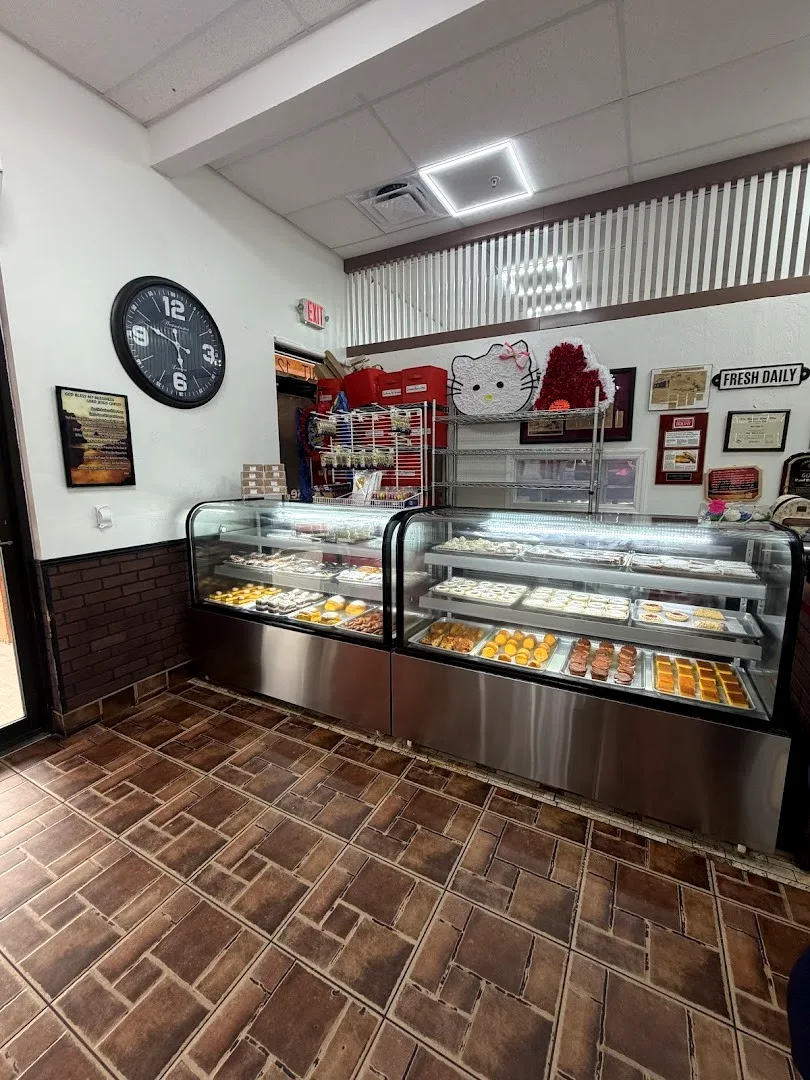 The tile floor and the two display cases by the door
